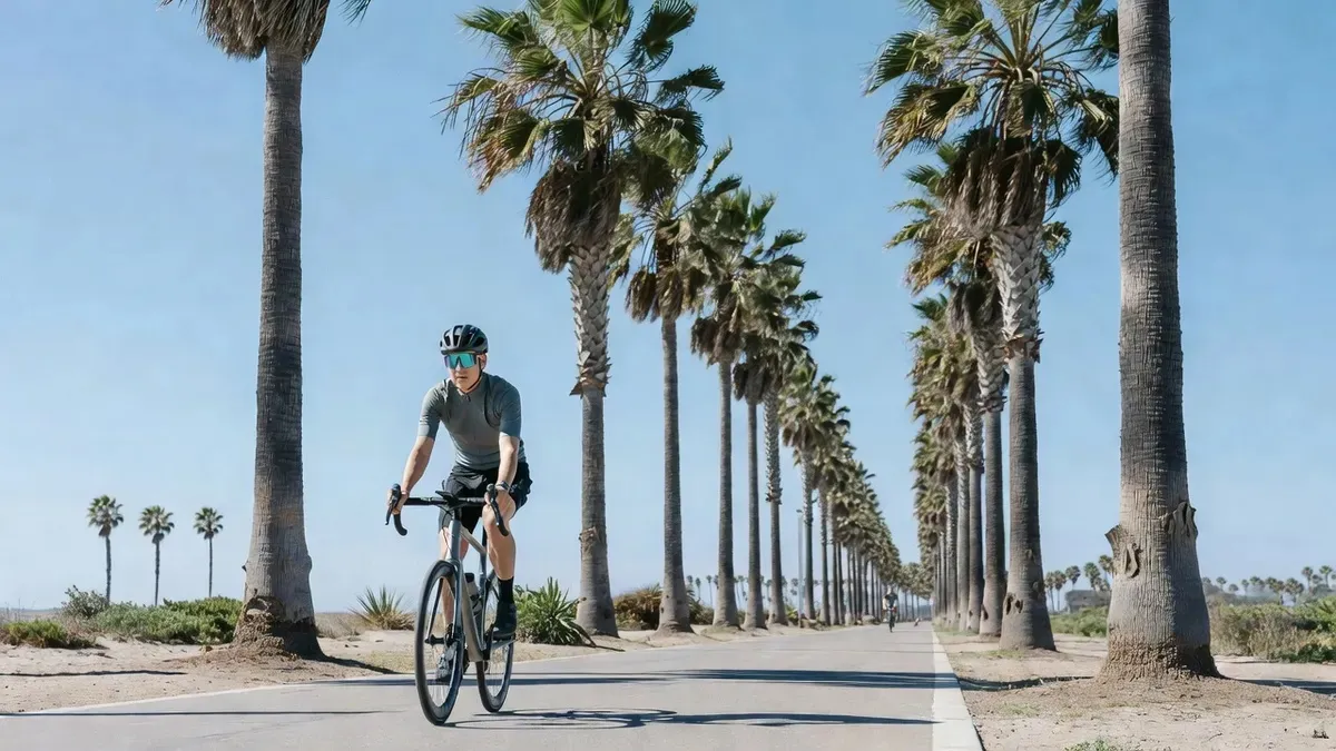 Couple riding Specialized Turbo Como electric bikes along the Cabrillo bike path on a santa barbara electric bike rental near the harbor and waterfront, California
